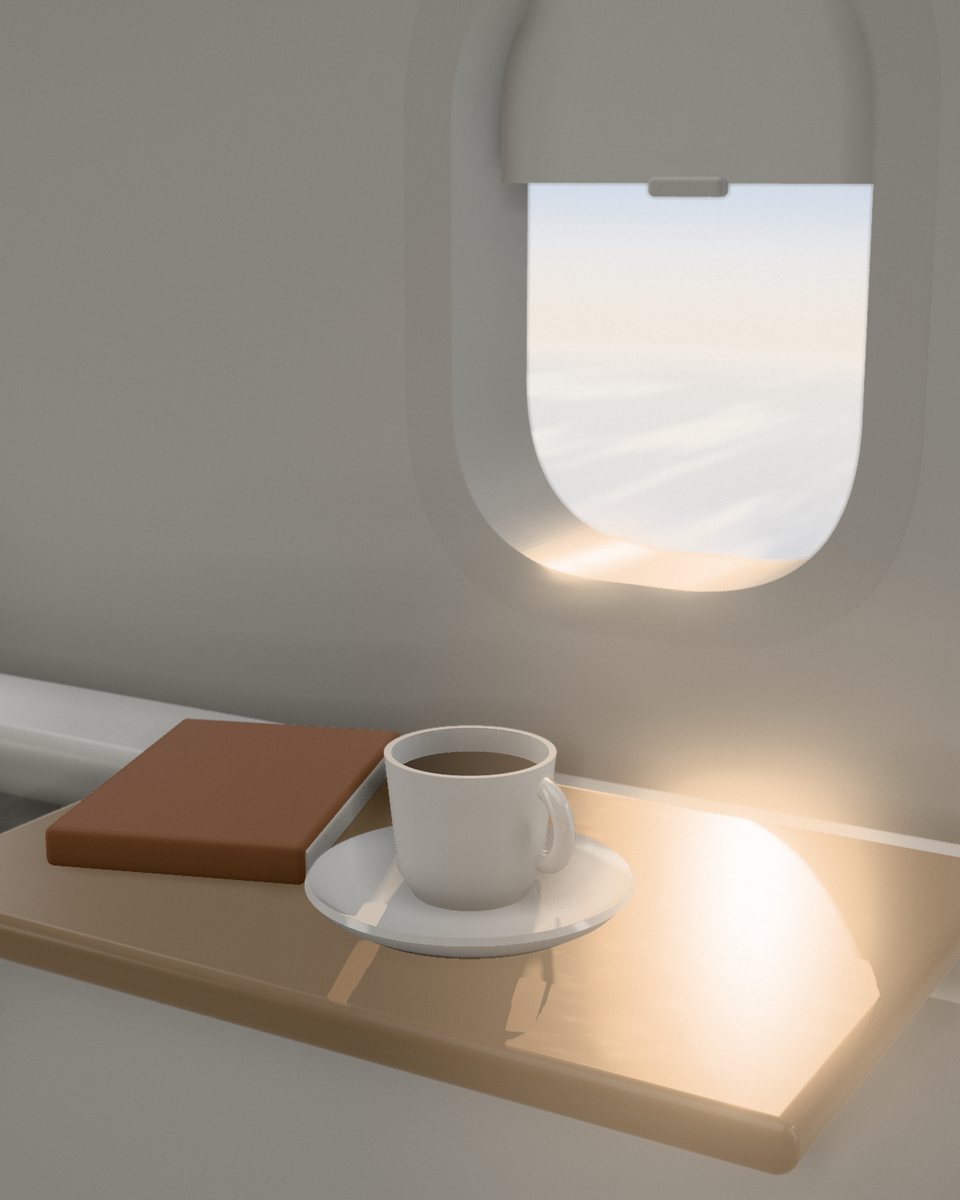 A window seat in the morning: coffee and a book on the tray table, sun across it